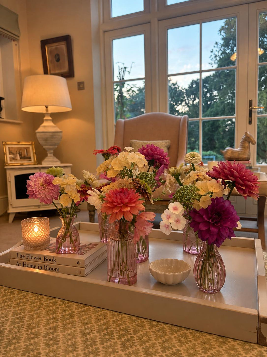Five Botanica bud vases filled with seasonal flowers